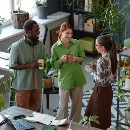 business-team-of-three-chatting-at-coffee-break